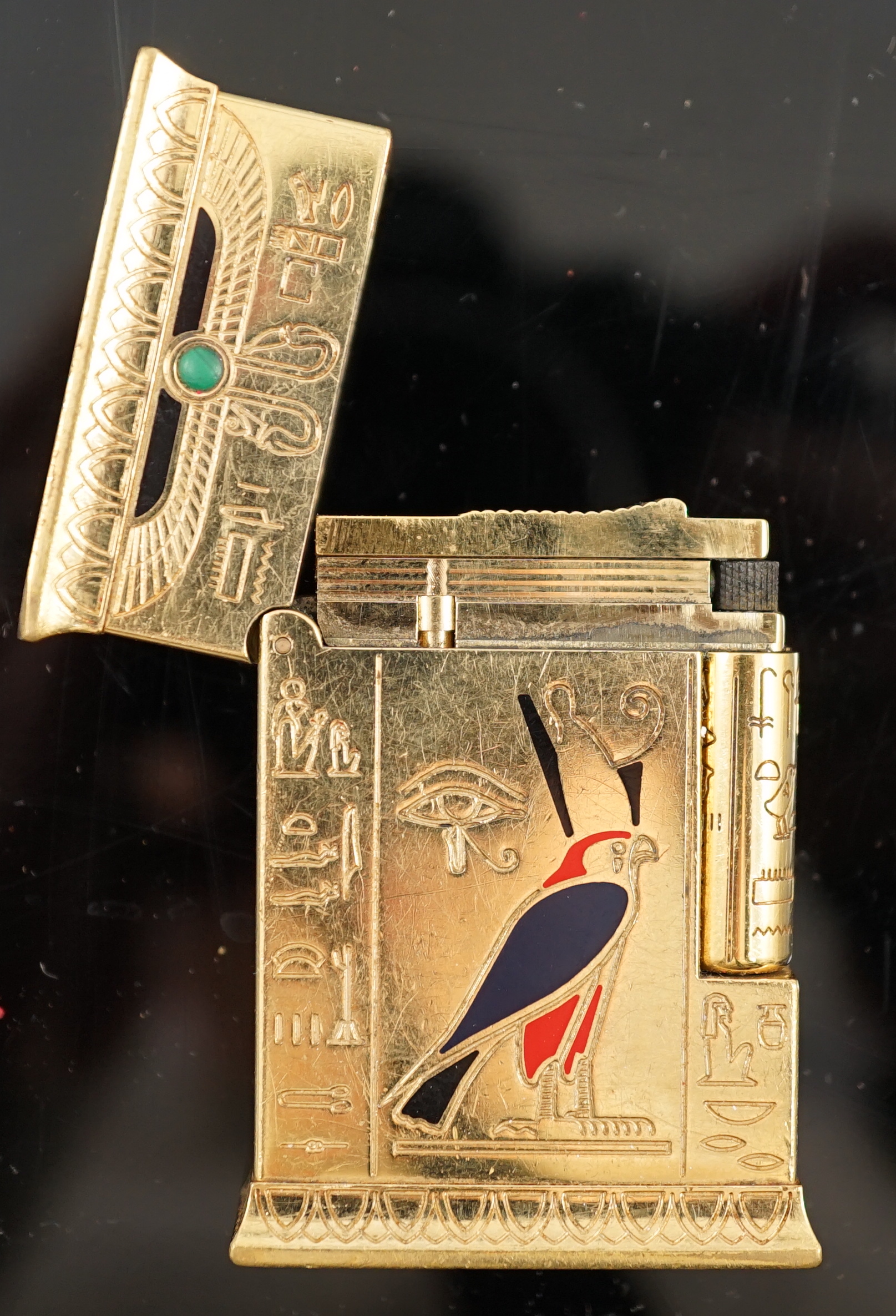 An S.J. Dupont gold plated, cabochon malachite and polychrome enamel set limited edition Pharaoh cigarette lighter